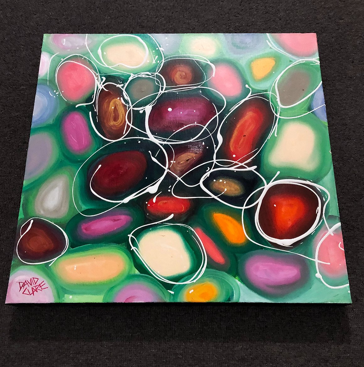 69164a62e1b8ea140711df10_bright-red-and-green-pebbles-bottom_1773534354180.jpg