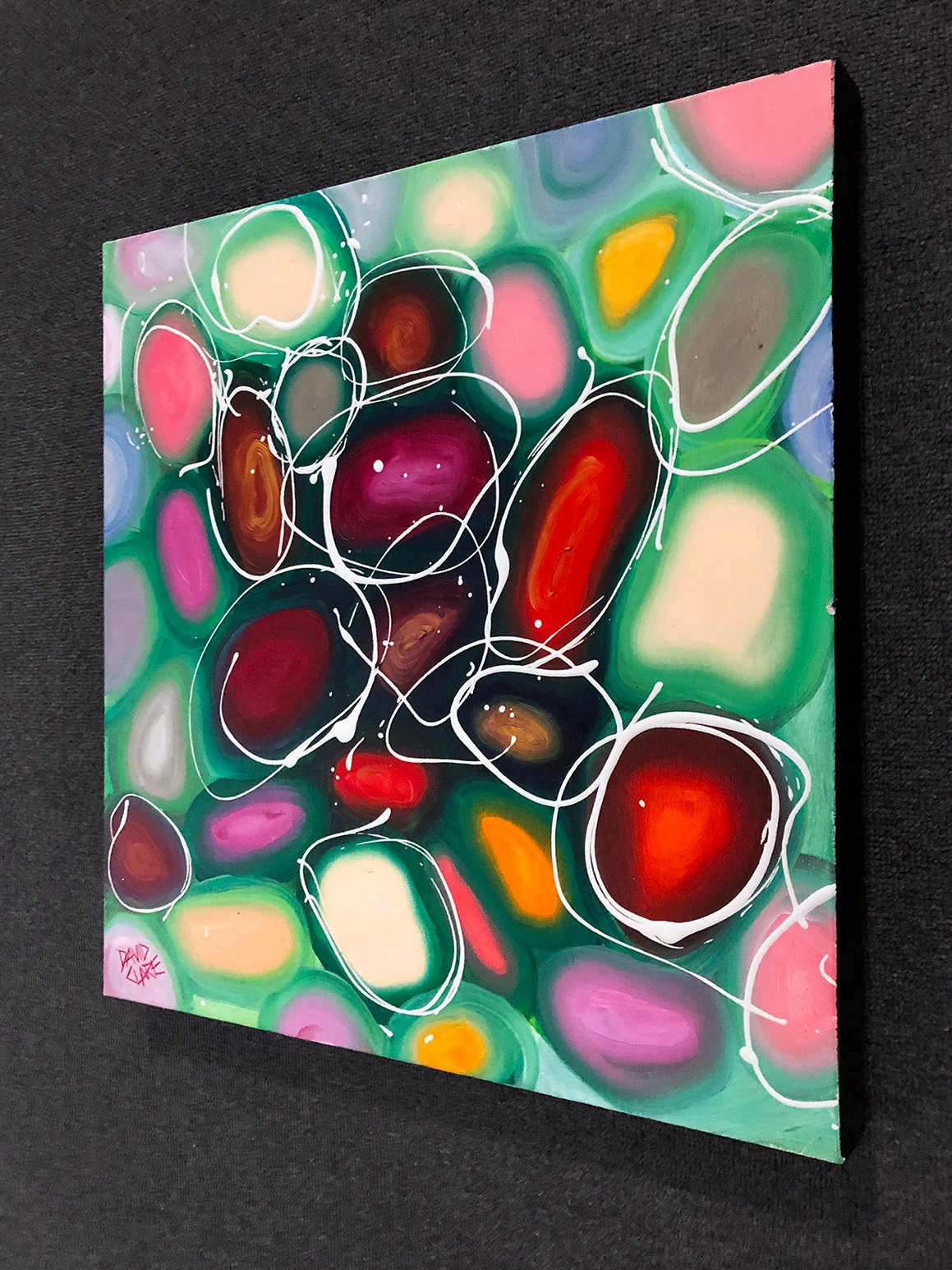 69164a62e1b8ea140711df10_bright-red-and-green-pebbles-hung_1773534354180.jpg