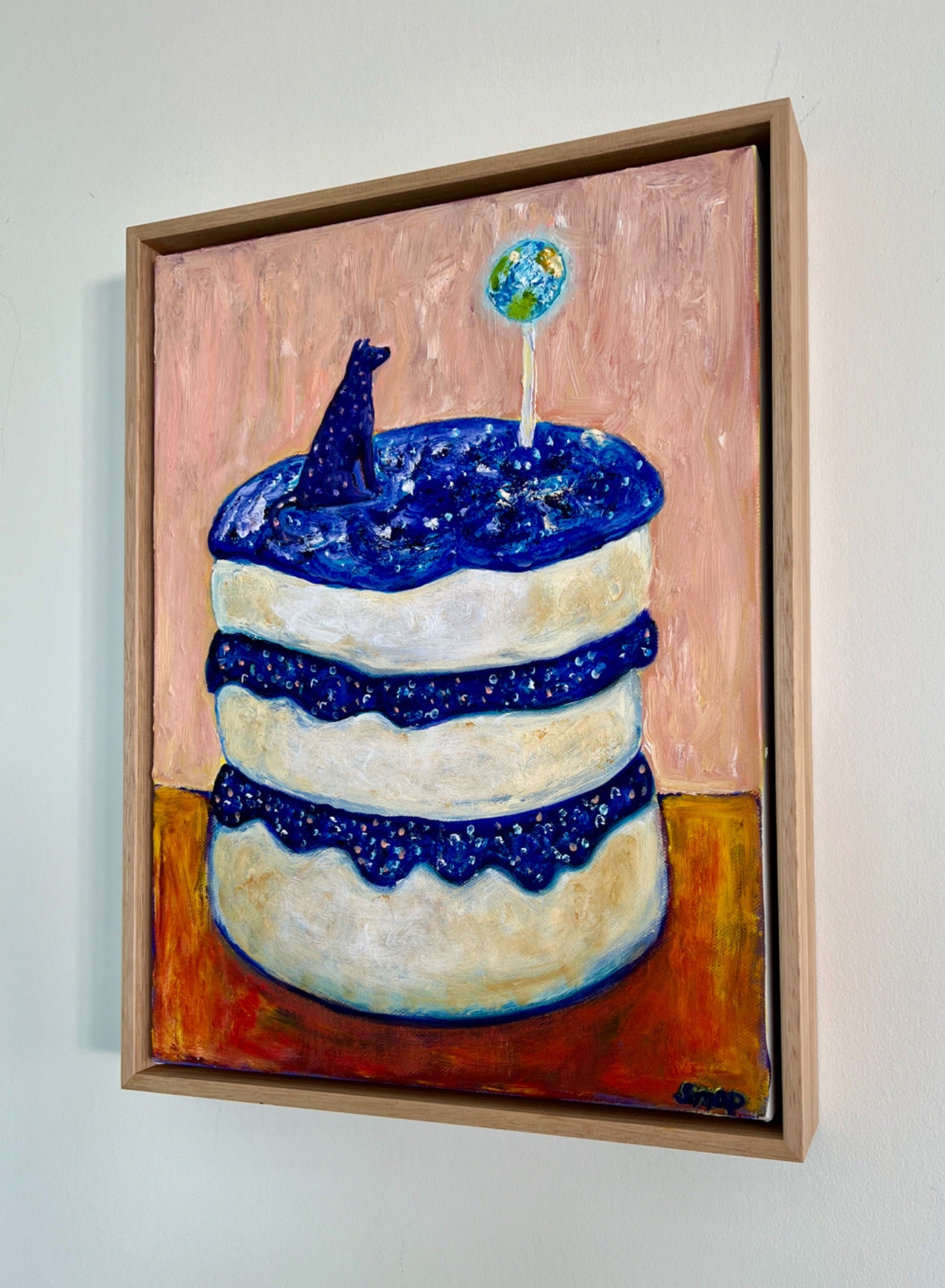 69164a62e1b8ea140711df10_cake-two-looking-at-the-world-susannah-paterson-frame-_1773967748465.jpeg