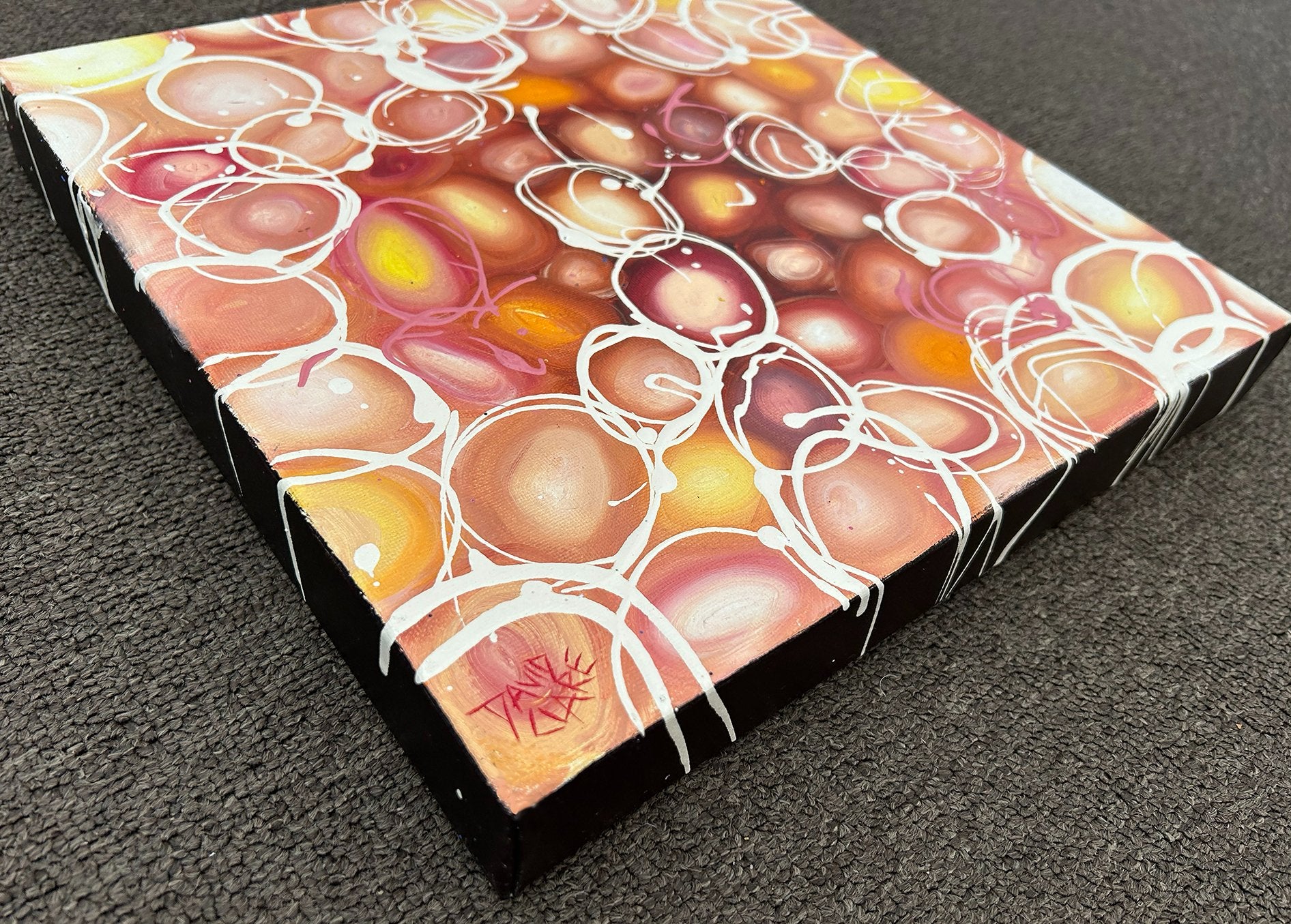 69164a62e1b8ea140711df10_tiny-pink-and-orange-pebbles-sign-corner-lr_1776715879630.jpg