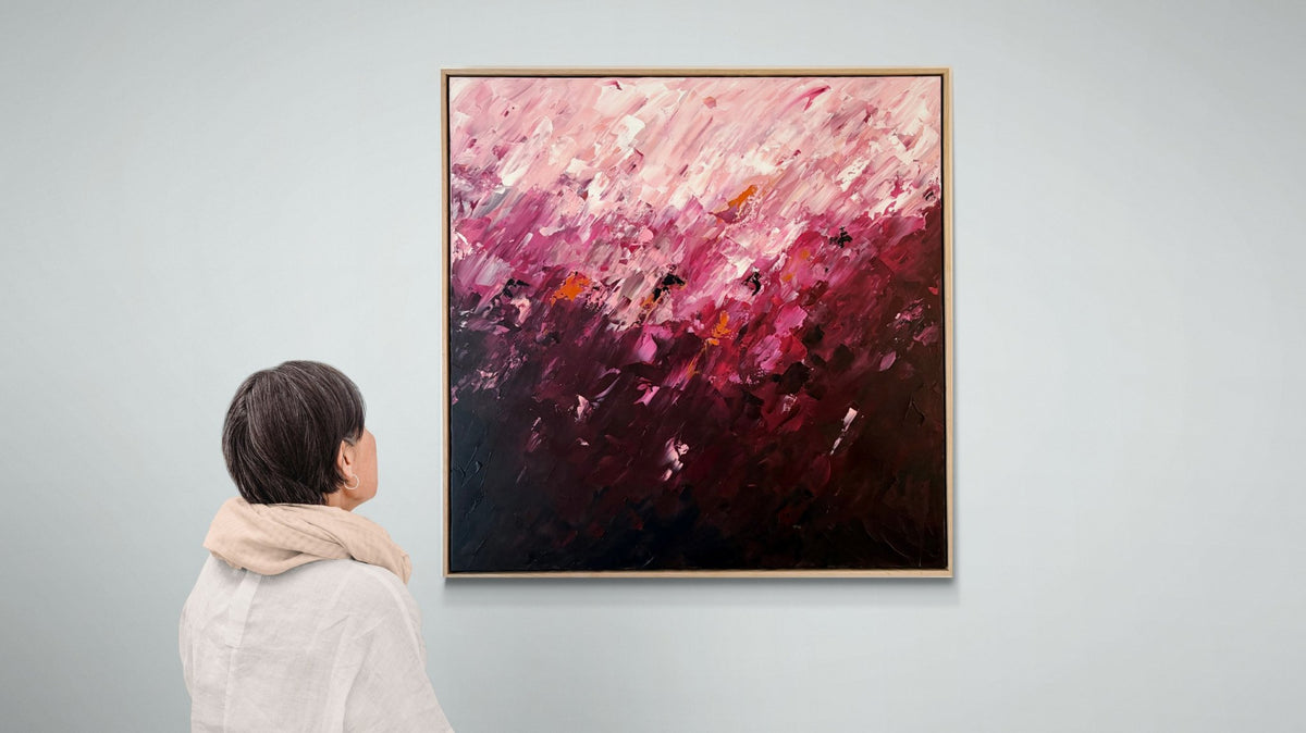 69164a62e1b8ea140711df10_woman-looking-at-a-gallery-wall-3_1790470029630.jpg
