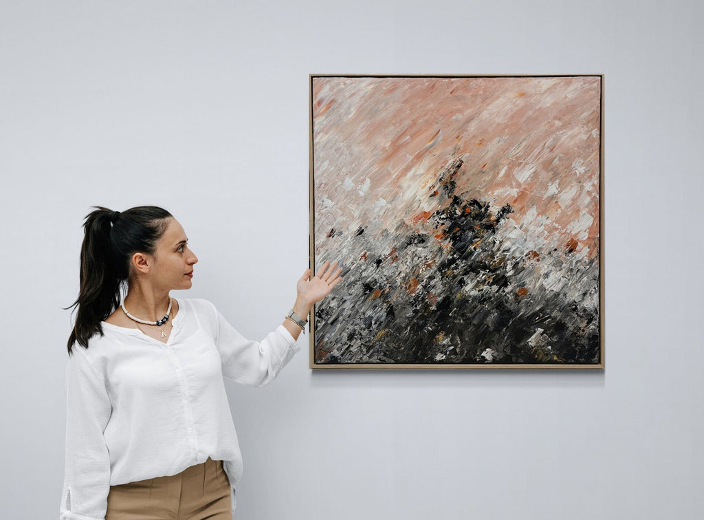 69164a62e1b8ea140711df10_young-woman-gesturing-next-to-a-gallery-wall-3_1791005912813.jpg